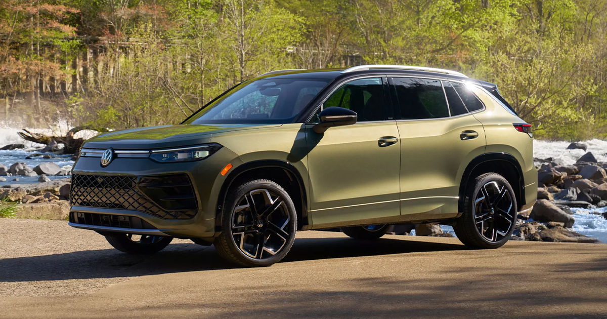 A Volkswagen Tiguan parked beside a rocky river.